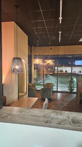 Drip Coffee interior at evening with warm pendant lighting